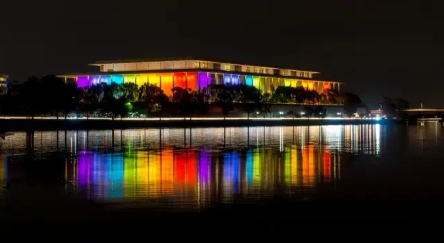 The Kennedy Center illuminated in a rainbow of colors in recognition of the upcoming Kennedy Center Honors. Washington^ DC / USA - November 19^ 2019