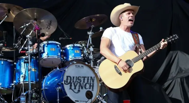 Dustin Lynch performs during the 'Kick The Dust Up' Tour at Vanderbilt Stadium on July 11^ 2015 in Nashville^ Tennessee.