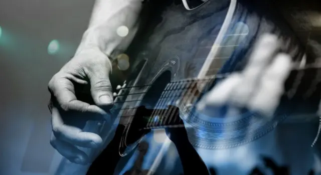 country artist/Guitarist with the audience in a double exposure