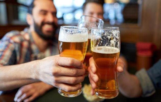 happy-male-friends-drinking-beer-at-bar-or-pub