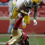 Green Bay Packers tight end Marcedes Lewis flips over San Francisco 49ers middle linebacker Kwon Alexander during the first half of the NFL NFC Championship football game Sunday, Jan. 19, 2020, in Santa Clara, Calif. (AP Photo/Marcio Jose Sanchez)
