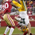 Green Bay Packers wide receiver Allen Lazard (13) falls to the ground between San Francisco 49ers free safety Jimmie Ward (20) and Emmanuel Moseley during the first half of the NFL NFC Championship football game Sunday, Jan. 19, 2020, in Santa Clara, Calif. (AP Photo/Tony Avelar)