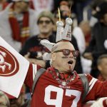 A San Francisco 49ers fans cheers during the second half of the NFL NFC Championship football game against the Green Bay Packers Sunday, Jan. 19, 2020, in Santa Clara, Calif. (AP Photo/Marcio Jose Sanchez)