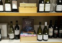 wine-glass-and-books-paired-with-wines-on-the-shelf
