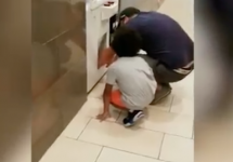 kid crawls into arcade game