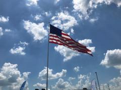 Flag in sky with clouds