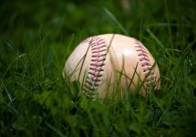 one-aged-and-worn-baseball-sitting-in-the-green-grass_rtmvpdrss-jpg-2