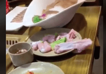 raw chicken moves off of a plate