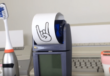 electric-devices-with-rock-and-roll-sign-on-receipt-printer-png