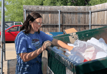 woman-digging-in-dumpster-with-smile-on-her-face-png-2