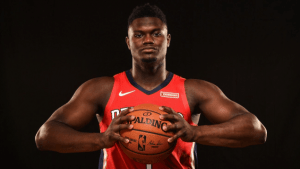 zion-williamson-pelicans-red-jersey-holding-basketball-png-2