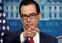steve mnuchin points during press conference white house logo in background