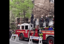 firefighter-playing-guitar-on-top-of-a-fire-truck-lower-manhattan-png-2