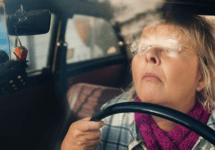 woman-driving-too-close-to-steering-wheel