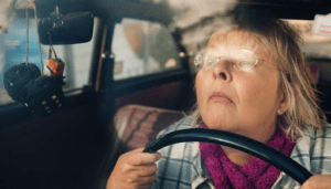 woman-driving-too-close-to-steering-wheel