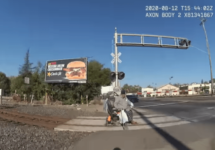 man-in-wheelchair-on-stuck-on-railroad-tracks-cop-bodycam-png