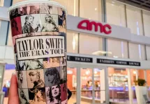 Taylor Swift The Eras Tour Film logo in front of AMC theaters