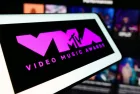 Mobile phone with logo of award show MTV Video Music Awards (VMA) in front of website. Focus on center-left of phone display. Unmodified photo.