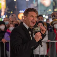 Ryan Seacrest is seen in Times Square during a New Year's Eve broadcast. NEW YORK^ N.Y. – December 31^ 2021