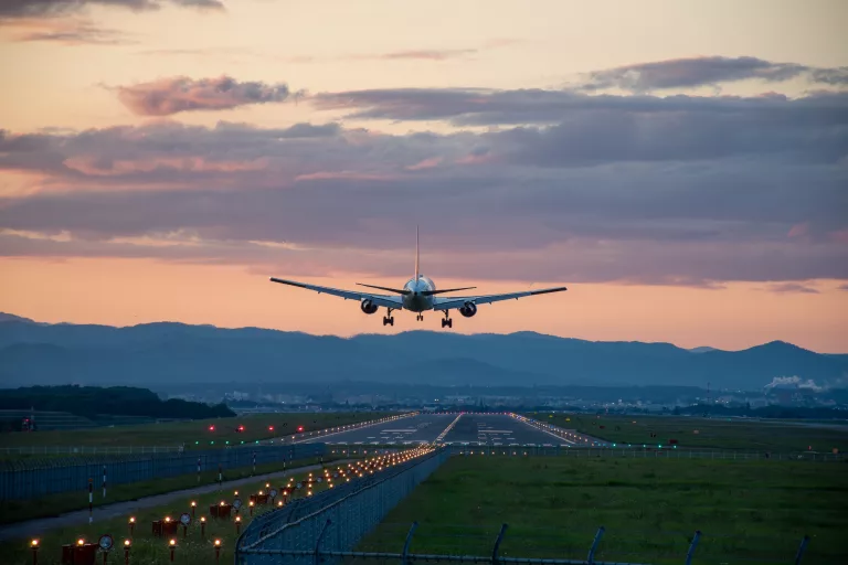 jetplanelandingatanairportatdusk