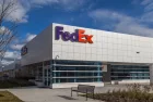 FedEx logo on the building of FedEx Ship Centre in Toronto. TORONTO^ CANADA - NOVEMBER 19^ 2017