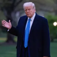 President Donald Trump walks across the south lawn after stepping off Marine 1 Washington DC^ United States^ April 6 2025