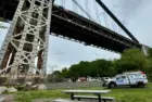 NYPD Police truck responding to a person who has climbed up the George Washington Bridge in Fort Washington Park New York^ NY USA - May 18^ 2024