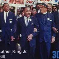 Martin Luther King during a protest march on postage stamp Milan^ Italy – January 7^ 2024