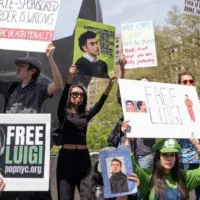 Activists gathered in front of Federal Court where Luigi Mangione was arraigned on Federal Charges accusing him of killing United HealthCare CEO Brian Thompson New York - April 25^ 2025