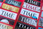 Colorful close-up of overlapping TIME Magazine covers^ highlighting diverse headlines on world leaders^ politics^ business^ and social issues. Calgary^ Alberta^ Canada. Dec 1^ 2025