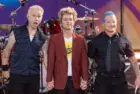 Mike Dirnt^ Billie Joe Armstrong^ Tre Cool pose on stage during ABC Good Morning America rock group Green Day concert in Central Park in New York on July 26^ 2024