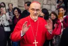 Cardinal Pierbattista Pizzaballa^ Latin Patriarch of Jerusalem^ greets the crowd as he leaves the Church of the Nativity after the Christmas celebrations. Bethlehem^ West Bank^ December 25^ 2025