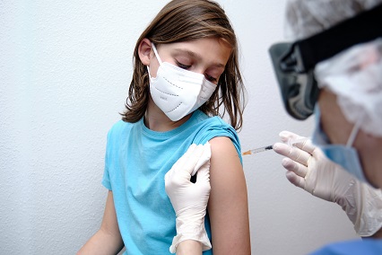 female-doctor-giving-covid-19-vaccine-to-a-boy