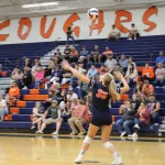 img_0473: Layla Escue watches as the ball drops before a serve. 