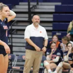 img_0492: Hannah Penner stands with head coach Shane Decker watching on. 