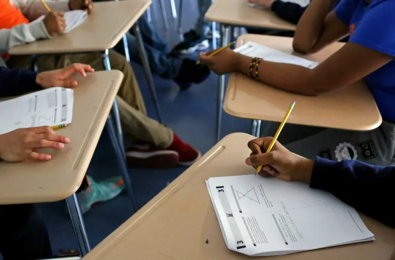 students-taking-test-logo