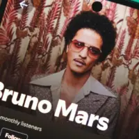 A smartphone displaying Bruno Mars's artist profile on Spotify. January 5^ 2025
