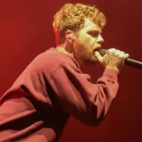 Alex Warren performs in Hollywood^ Florida^ on October 8^ 2025. The performance was part of his Cheaper Than Therapy world tour.