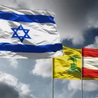 Flags of Israel above dark sky. Hezbollah and Lebanon flags in background