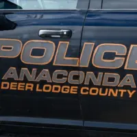 Sign on Anaconda Deer Lodge County police car in closeup. Anaconda^ MT^ USA - May 6^ 2025