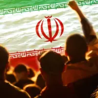 Defocus protest in Iran. Conflict war over border. World crisis. Country flag. Woman low rights. Male hands. Out of focus.