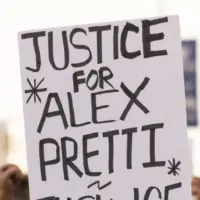 People protest the ICE killing of Alex Pretti in front of the downtown Federal Building. Los Angeles^ California^ USA - January 25^ 2026