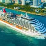 Cruise ship (Carnival Magic) entrance to Atlantic Ocean^ from Miami port.USA. FLORIDA. MIAMI BEACH. DECEMBER^ 2018