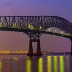 Francis Scott Key bridge with Baltimore skyline at night