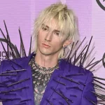 Machine Gun Kelly (MGK) at the 2022 American Music Awards at the Microsoft Theatre. LOS ANGELES^ CA. November 20^ 2022