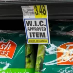 Fresh Express bagged lettuce on display at grocery store supermarket.