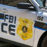 Close up view of the badge on the side of a police patrol car used by the FBI. Washington DC^ USA - 30 April 2024