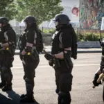 Minneapolis^ Minnesota / USA - May 29 2020: close up state patrol police officers standing guard towards minneapolis riots for George Floyd