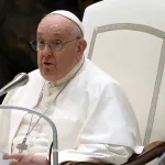 Pope Francis reads during his weekly general audience in the Paul VI hall. VATICAN CITY^ VATICAN - 10 JANUARY 2024