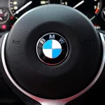 BMW X4 M Performance steering wheel. BMW X4 interior. BMW X4 dashboard. New car SUV steering wheel. Buttons on the steering wheel^ hands-free system.